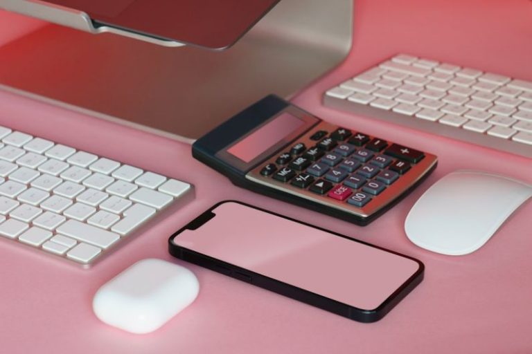 Budget Smartphones - a desk with a keyboard, mouse, and cell phone