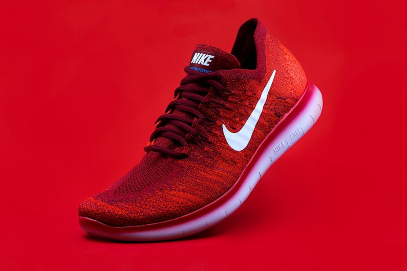 Shoes - unpaired red Nike sneaker